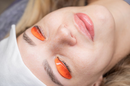 Caucasian woman undergoing eyelash lamination procedureの写真素材