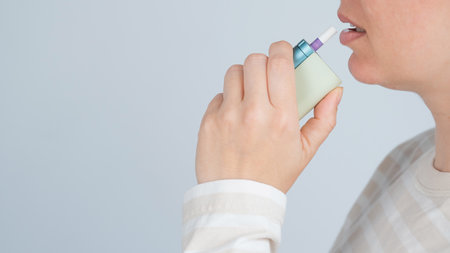 Caucasian woman smoking electronic cigaretteの写真素材