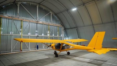 Yellow airplane glider in the hangarの写真素材