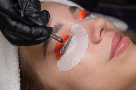 Caucasian woman undergoing eyelash lamination procedureの写真素材