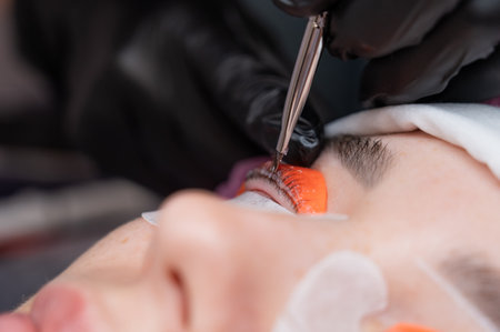 The process of professional lamination and tinting of eyelashes in the salonの写真素材