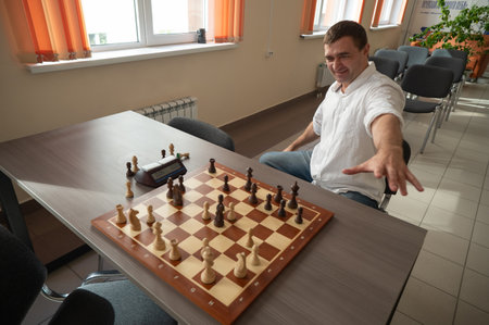 Caucasian man celebrates winning chessの写真素材