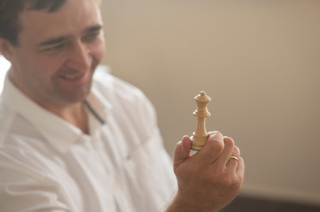 Middle aged Caucasian man playing chessの写真素材