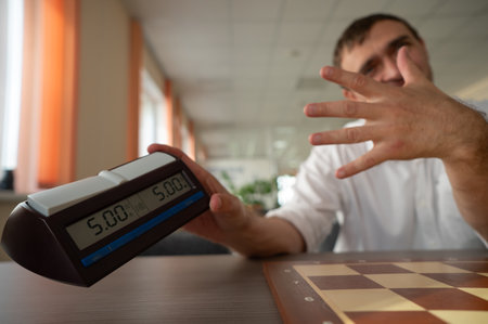 Middle aged Caucasian man playing chessの写真素材