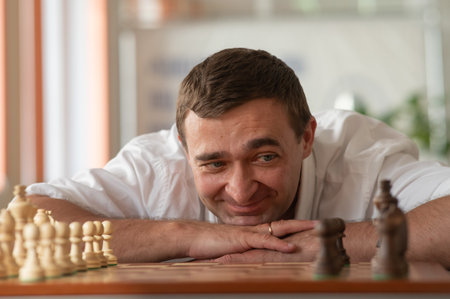 Middle aged Caucasian man playing chessの写真素材