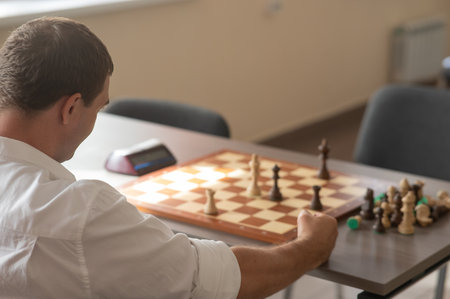 Middle aged Caucasian man playing chessの写真素材