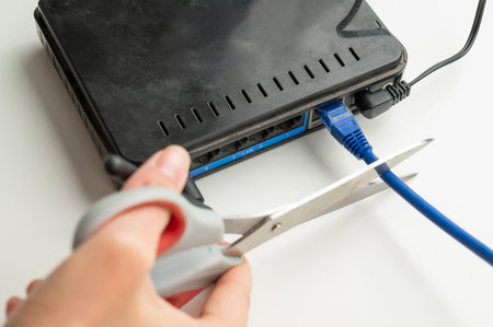 Scissors cut the router cablesの写真素材