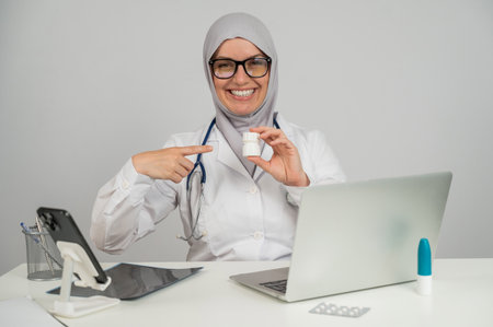 Female doctor in hijab recommends medicationsの写真素材