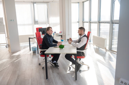 Two Caucasian men communicating at a business meetingの写真素材