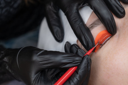 Caucasian woman undergoing eyelash lamination procedureの写真素材