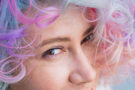 Close-up portrait of Caucasian woman with multi-colored hairstyleの写真素材