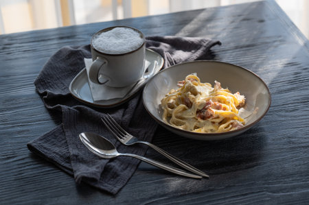 Pasta carbonara served in a cafeの写真素材