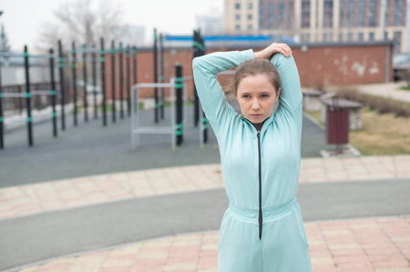 Young woman doing fitness outdoors