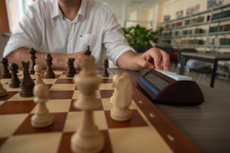 A man switches a chess clockの写真素材