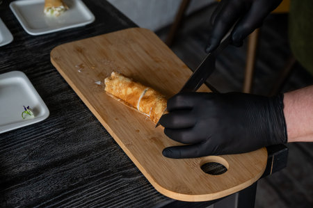 The cook prepares a fruit roll from pancakes