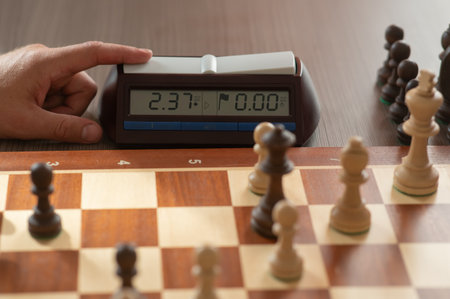 Close up of hands of middle aged caucasian man playing chessの写真素材