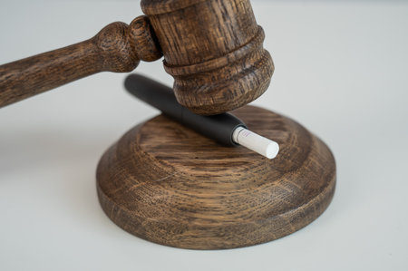 Judges gavel and electronic cigarette. Tobacco heating systemの写真素材