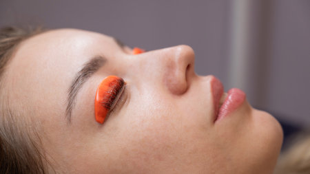 Caucasian woman undergoing eyelash lamination procedureの写真素材
