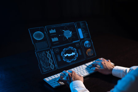 Caucasian man sits in the dark in front of a virtual menu. Close-up of male hands on the keyboard