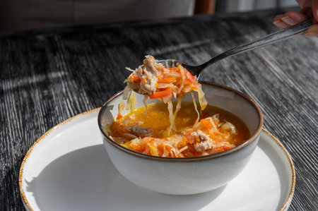 A bowl of shchi soup in a cafeの写真素材