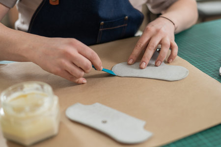 Woman tanner at work in the workshop