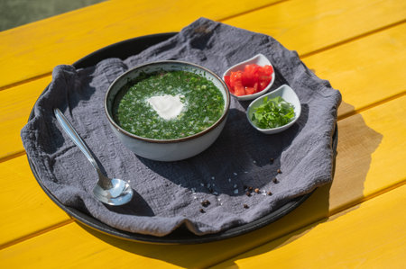 Traditional Russian lunch in a cafe. Top view of okroshka on a table in a summer cafeの写真素材