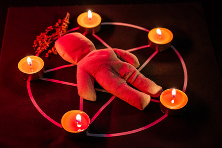 Voodoo doll on a pentagram. Witch spellsの写真素材
