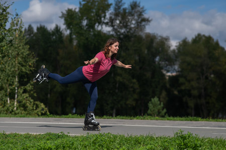 Caucasian woman roller skating in parkの写真素材
