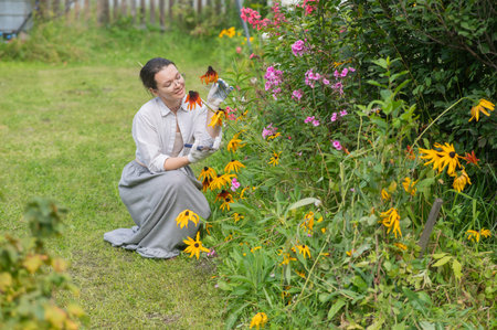 Caucasian woman tending her garden