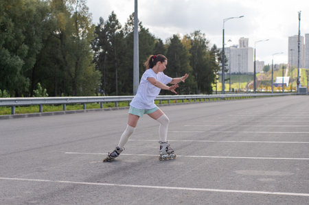 Caucasian woman in shorts roller skating