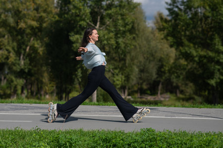 Caucasian woman roller skating in parkの写真素材