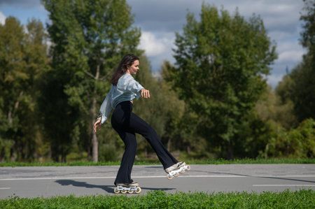 Caucasian woman roller skating in park