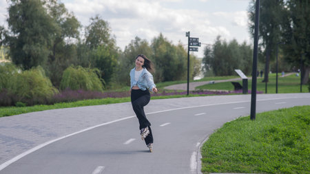 Caucasian woman roller skating in park