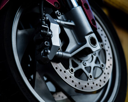 Close-up of a red motorcycle wheel