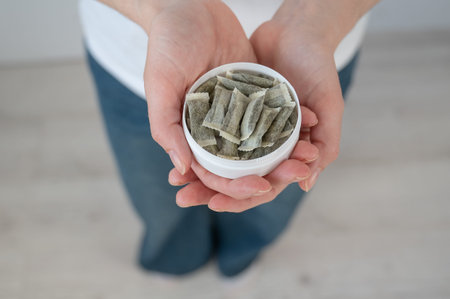 A woman holds a jar