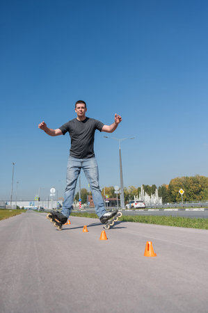 A Caucasian man rollerblades around the slalom course