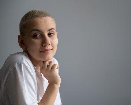 Portrait of pensive young woman with short hair. Copy space.の写真素材