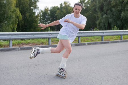 Caucasian woman rollerblading fast on road