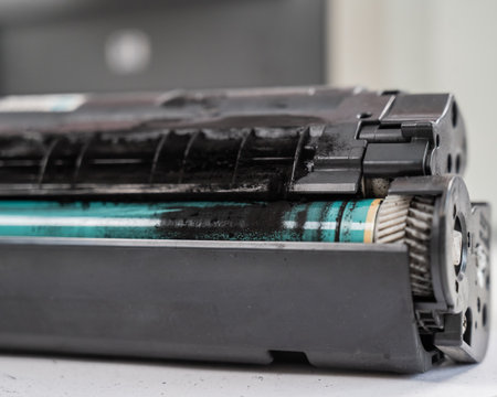 Broken laser printer cartridge on white backgroundの写真素材