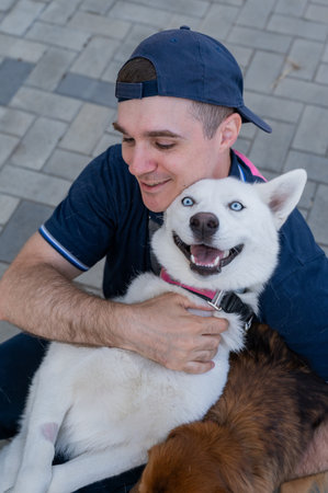 A man hugs his dogの写真素材