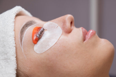 The process of professional lamination and dyeing of eyelashes and eyebrows in the salonの写真素材