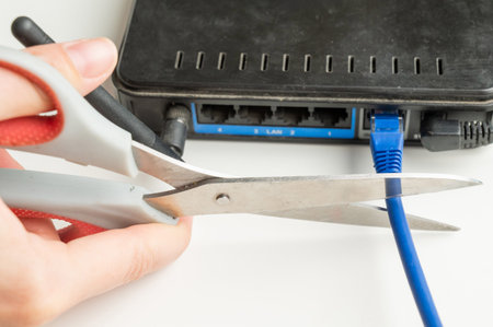 Scissors cut the router cablesの写真素材