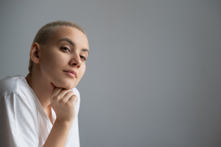 Portrait of pensive young woman with short hair. Copy space.の写真素材