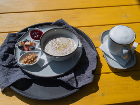 A plate of porridge on a table in a street cafeの写真素材