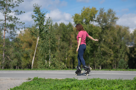 Caucasian woman roller skating in park