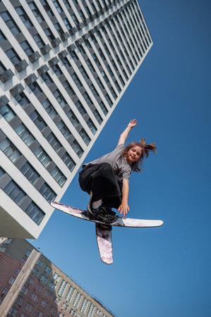 Girl practices tricks on a trampoline