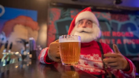 Santa Claus drinking beer at a barの写真素材