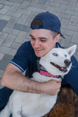 A man hugs his dog