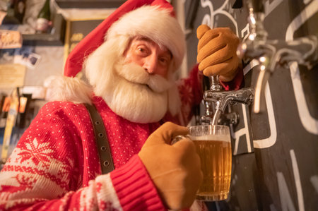 Santa Claus pouring beer in a pubの写真素材