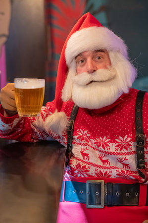 Santa Claus drinking beer in a pubの写真素材